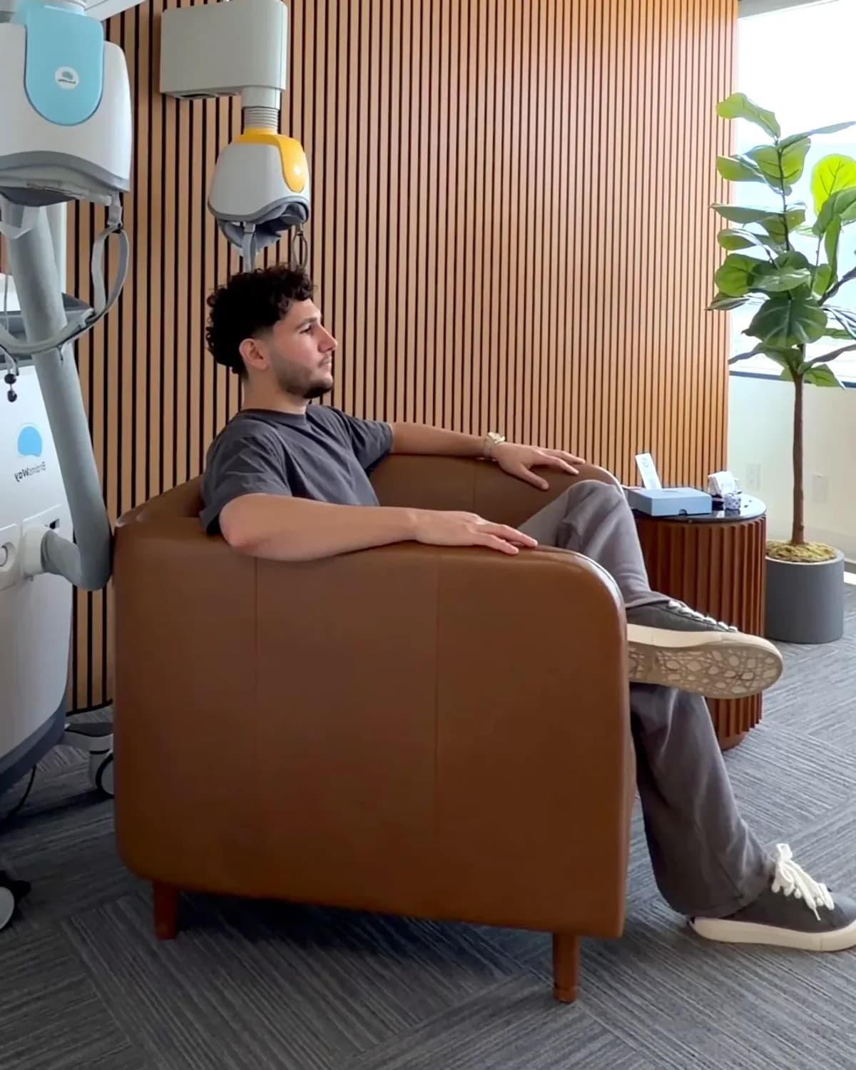 Patient receiving BrainsWay Deep TMS treatment